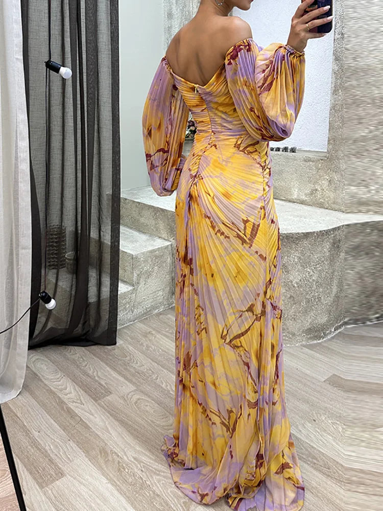 Multicoloured - Woman wearing a long sleeve, pleated floral maxi dress with a jewelled front trim and high slit