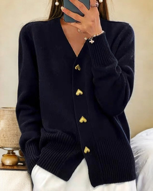 Black - Women's grey V-neck knit cardigan featuring metallic gold heart-shaped buttons, drop shoulders, and wide ribbed cuffs and hem.