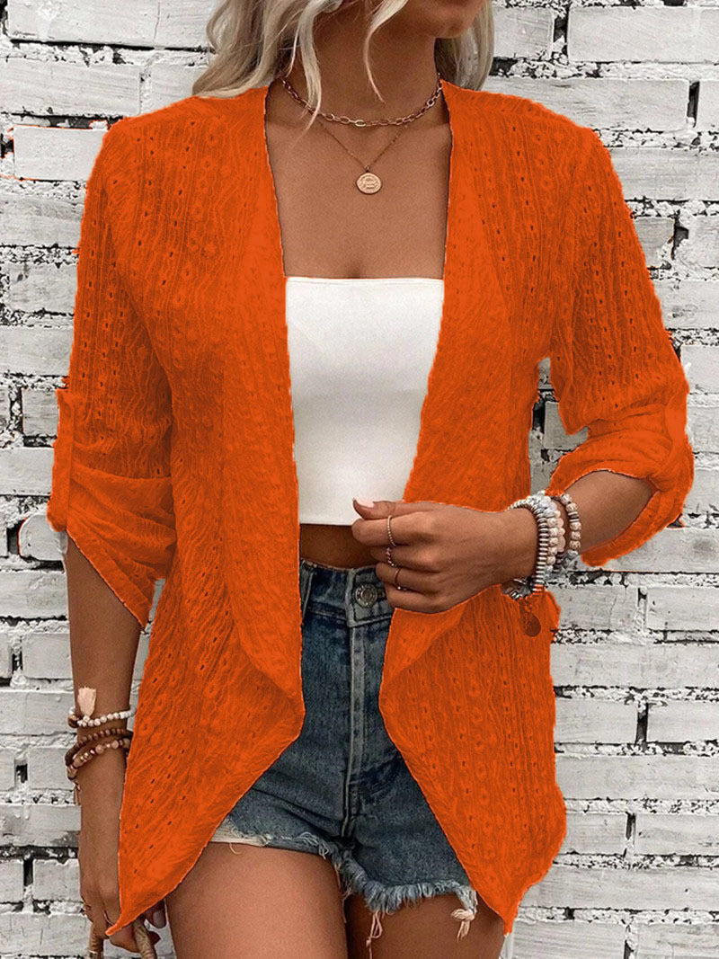Orange - Women's white lightweight open-front cardigan featuring a textured eyelet pattern, draped lapels, and roll-tab sleeves, styled over a white top and denim shorts.