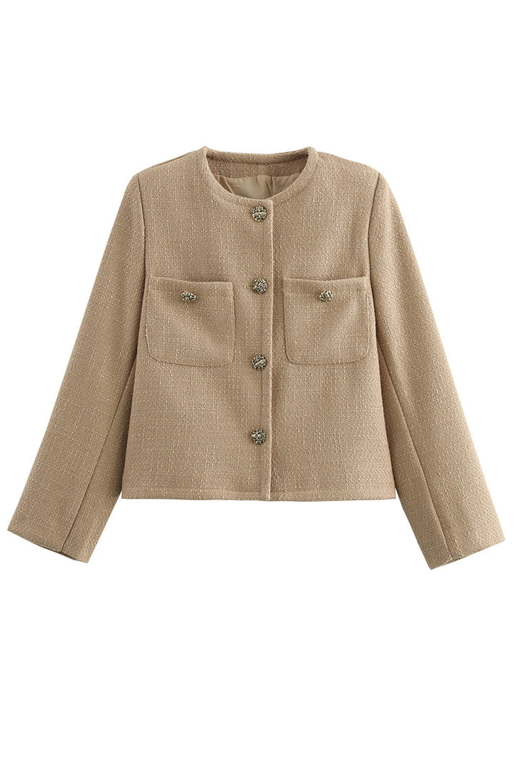 Khaki - Women's smart casual textured cropped jacket in a neutral tone, featuring ornate buttons and a collarless design, styled over a white t-shirt and denim shorts.