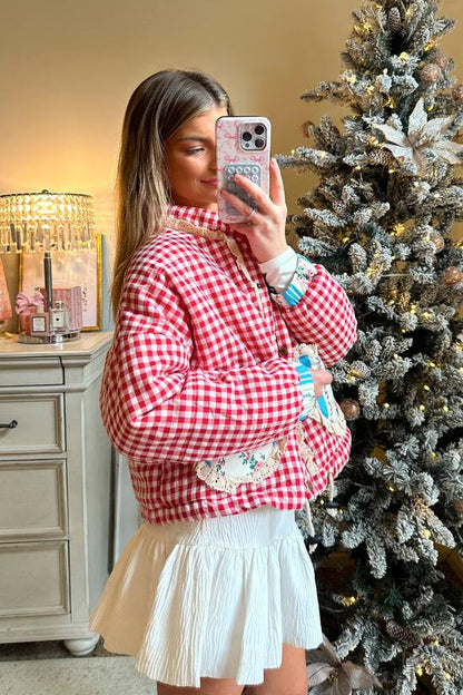 Pink - Women's cropped quilted jacket featuring a red and white gingham pattern, button-front closure, lace trim, and contrast floral heart-shaped patch pockets, worn over a white mini skirt.