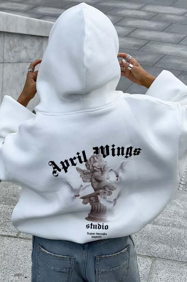 White - Back view of a woman wearing a dark grey oversized hoodie featuring a large graphic print of an angel statue and white doves, paired with a dark grey pleated mini skirt.