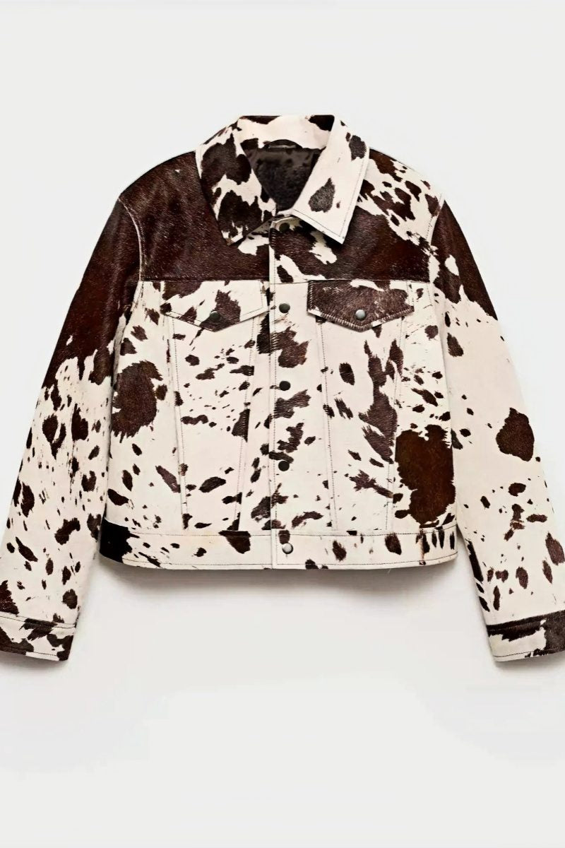 Dairy Cow - Women's cropped button-front jacket featuring a bold cow print pattern, pointed collar, and chest flap pockets.