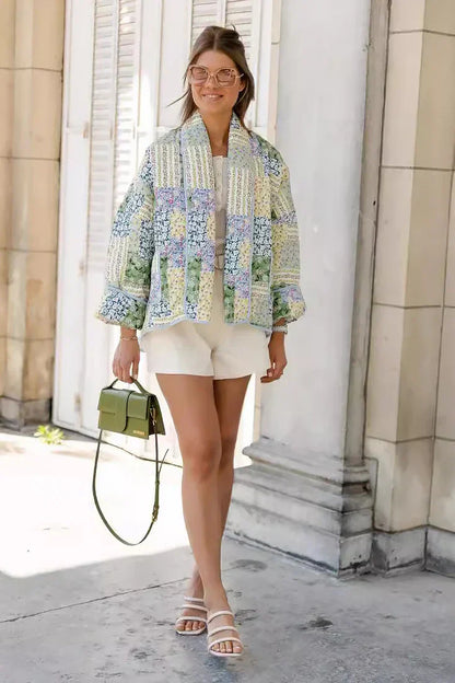 Multicolor - Women's relaxed-fit quilted jacket featuring a vibrant patchwork floral print in pastel greens and blues, styled open with contrast edge binding.