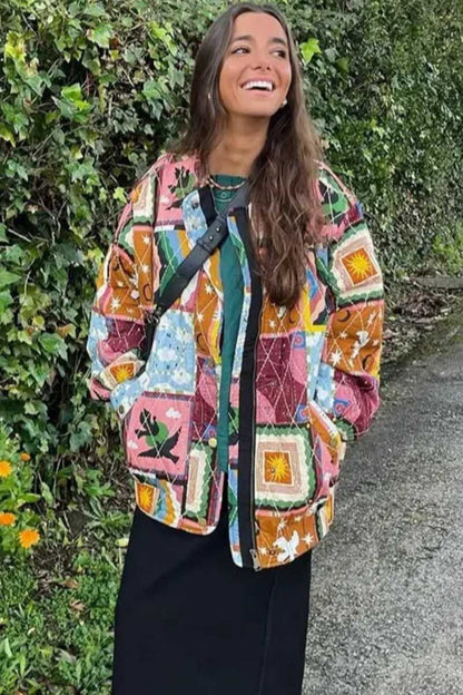 Multi - A woman wearing a vibrant, multi-coloured quilted patchwork jacket over a pink cardigan and white shirt, paired with white trousers.