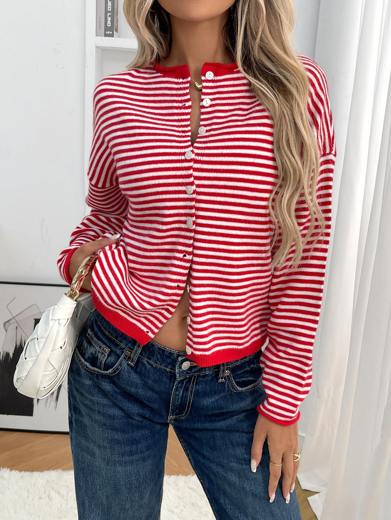 Red - Women's smart casual knit cardigan featuring red and white horizontal stripes, a button-front closure, and a relaxed fit, styled with blue jeans.