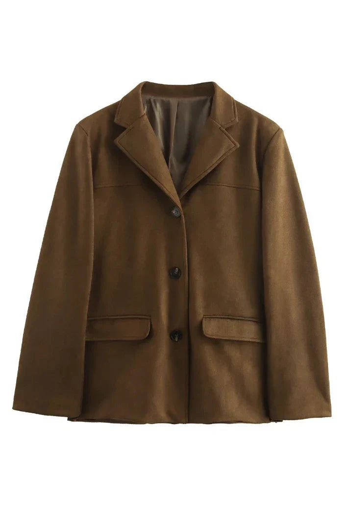 Ligh Brown - Woman wearing a brown longline suede-look jacket over a denim shirt outdoors.