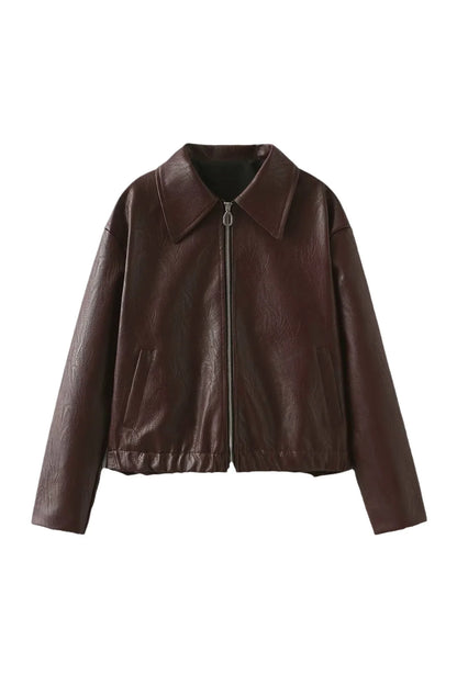 Amaranth - Women's deep burgundy faux leather zip-front cropped bomber jacket with a wide collar, styled over a black top and dark denim.