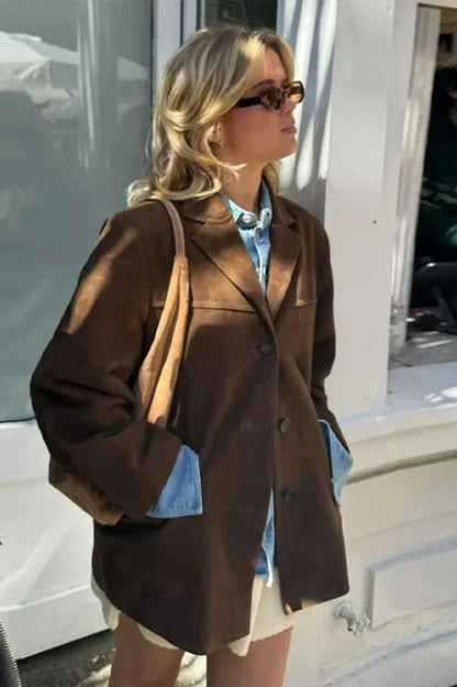 Ligh Brown - Woman wearing a brown longline suede-look jacket over a denim shirt outdoors.
