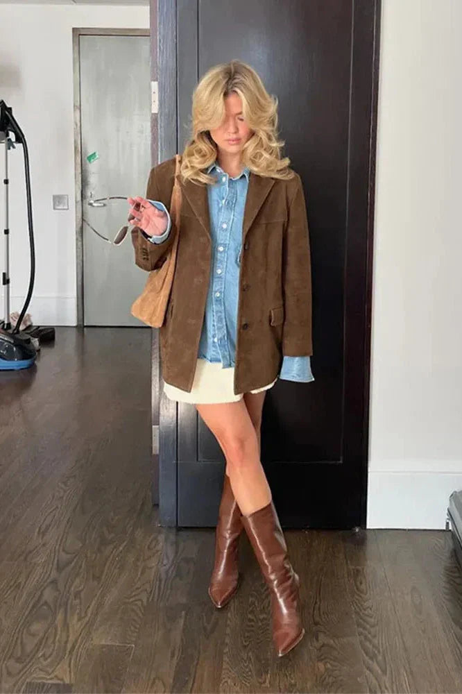 Ligh Brown - Woman wearing a brown longline suede-look jacket over a denim shirt outdoors.