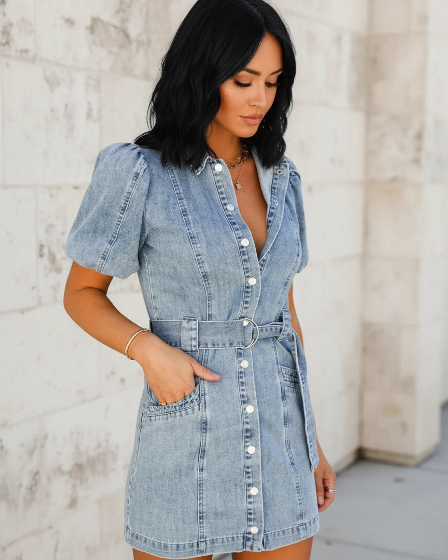 Blue - Women's light wash denim mini dress featuring short puff sleeves, a collared neckline, button-front closure, and a matching D-ring belt.