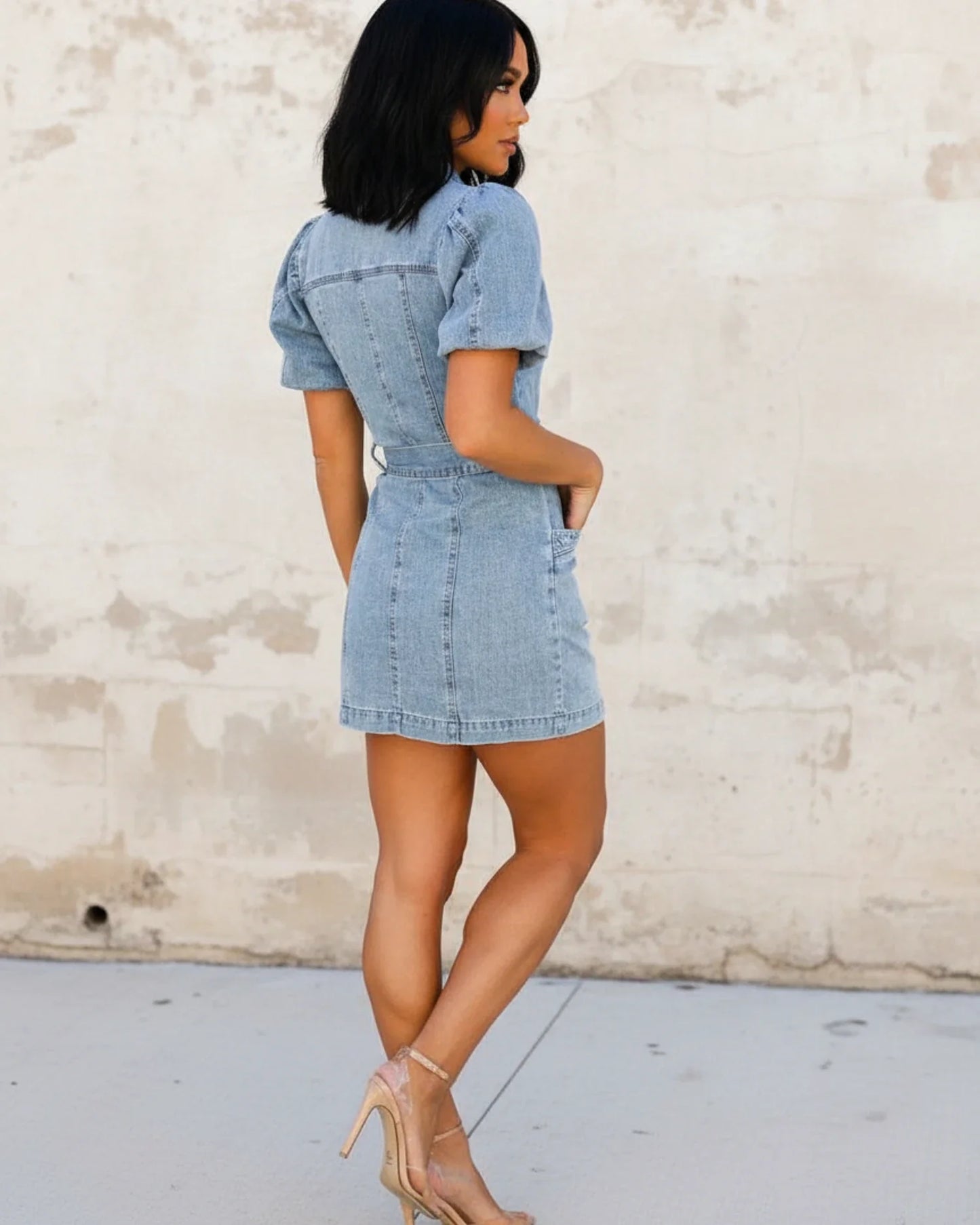Blue - Women's light wash denim mini dress featuring short puff sleeves, a collared neckline, button-front closure, and a matching D-ring belt.