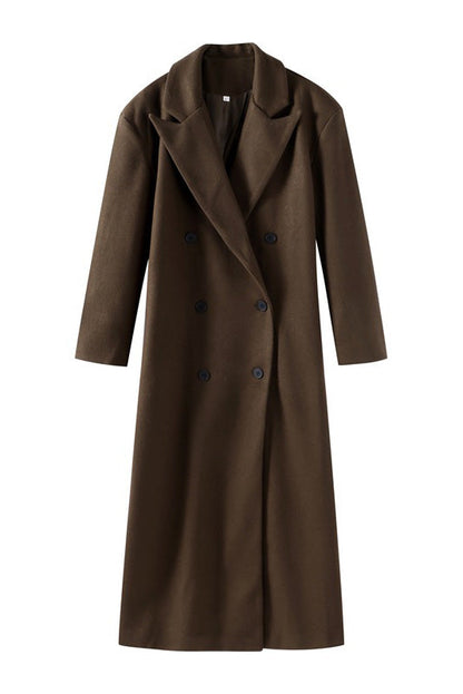 Brown - A person wearing a longline, double-breasted dark chocolate brown overcoat with notch lapels, styled over a beige knit sweater and cream silk skirt.