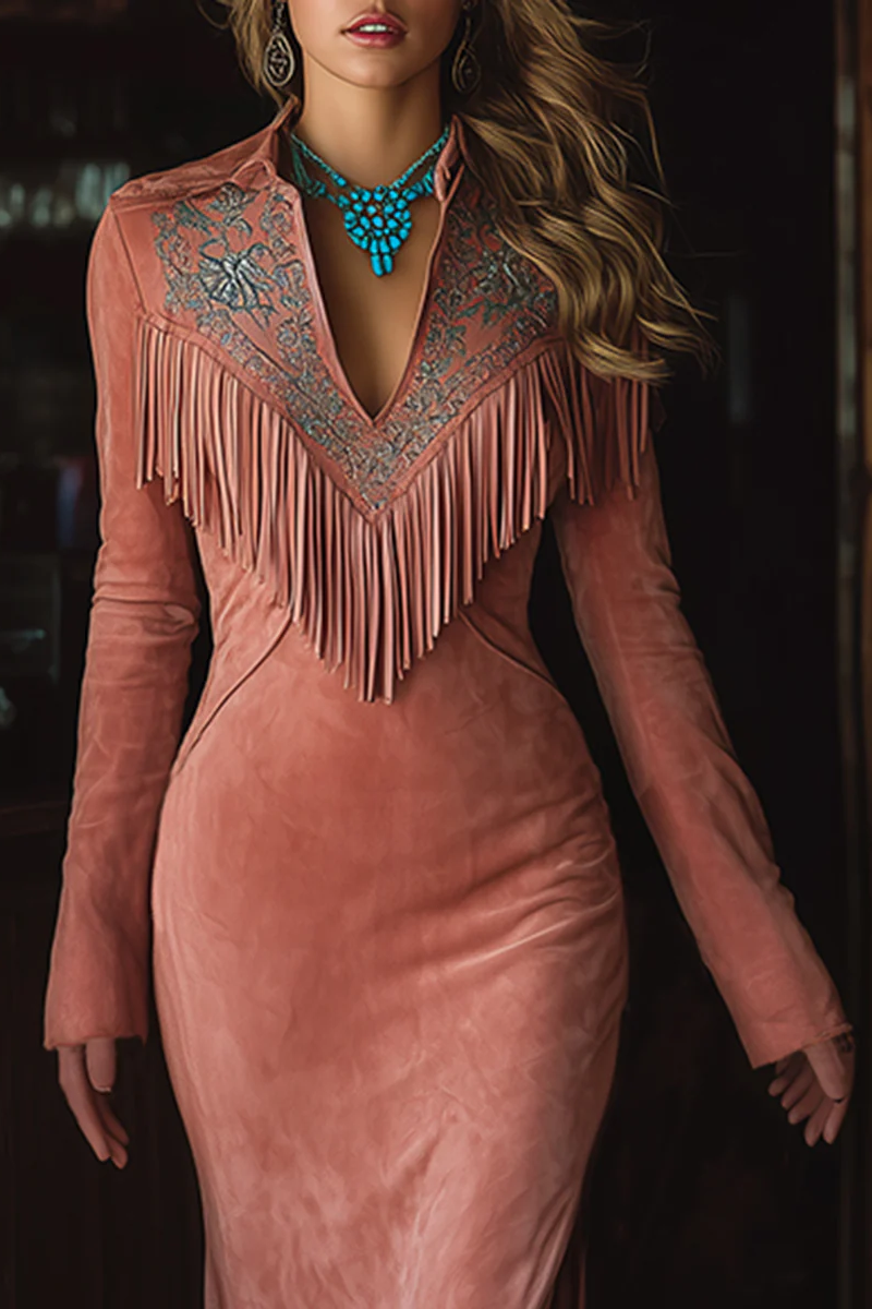 Pink - A woman wearing a dusty rose brushed suede maxi dress featuring western-style embroidery, a V-shaped fringe yoke, long sleeves, and a high leg slit, paired with embroidered cowboy boots.
