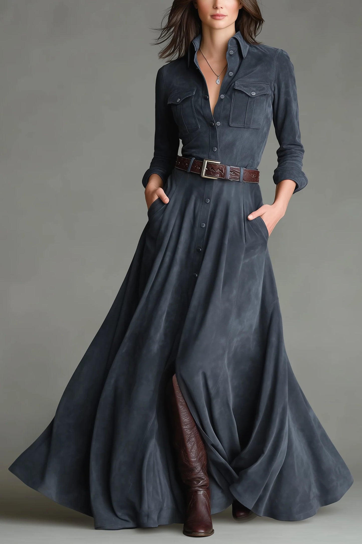 Blue - A woman wearing a slate grey brushed-texture maxi shirt dress with a collar, button-down front, chest utility pockets, a brown leather belt, and tall brown leather boots.