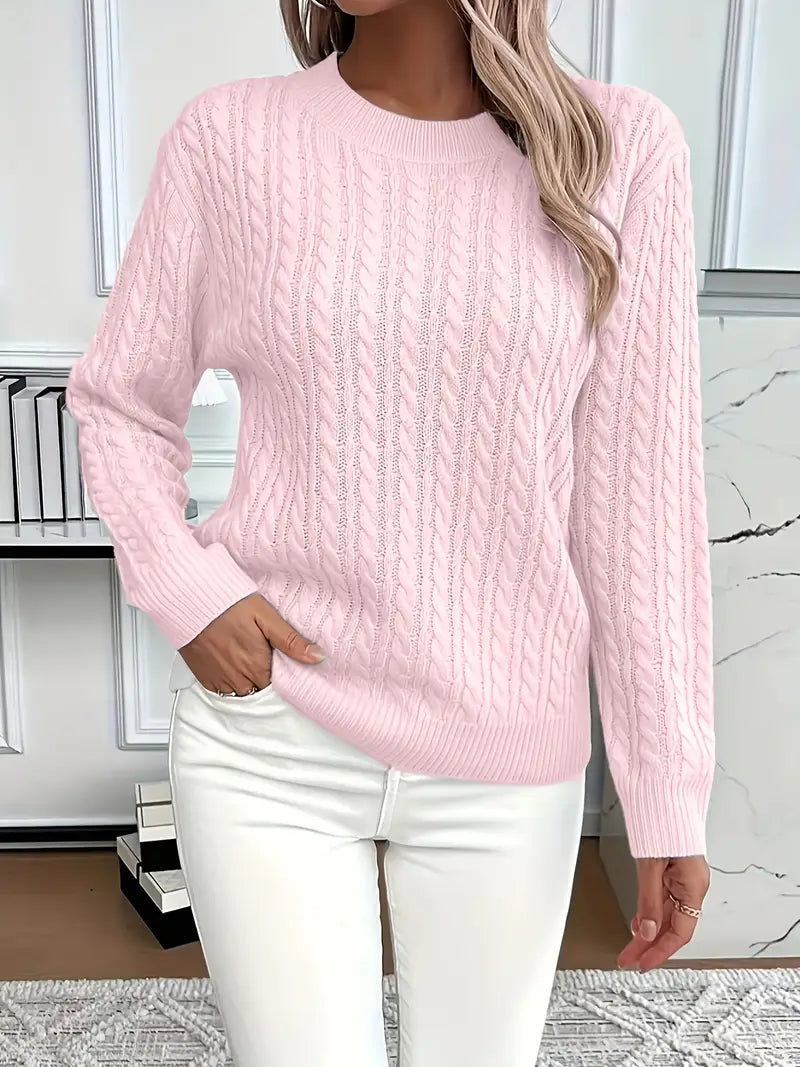 Pink - Women's light pink cable knit sweater with long sleeves and a crew neckline, worn with white pants.