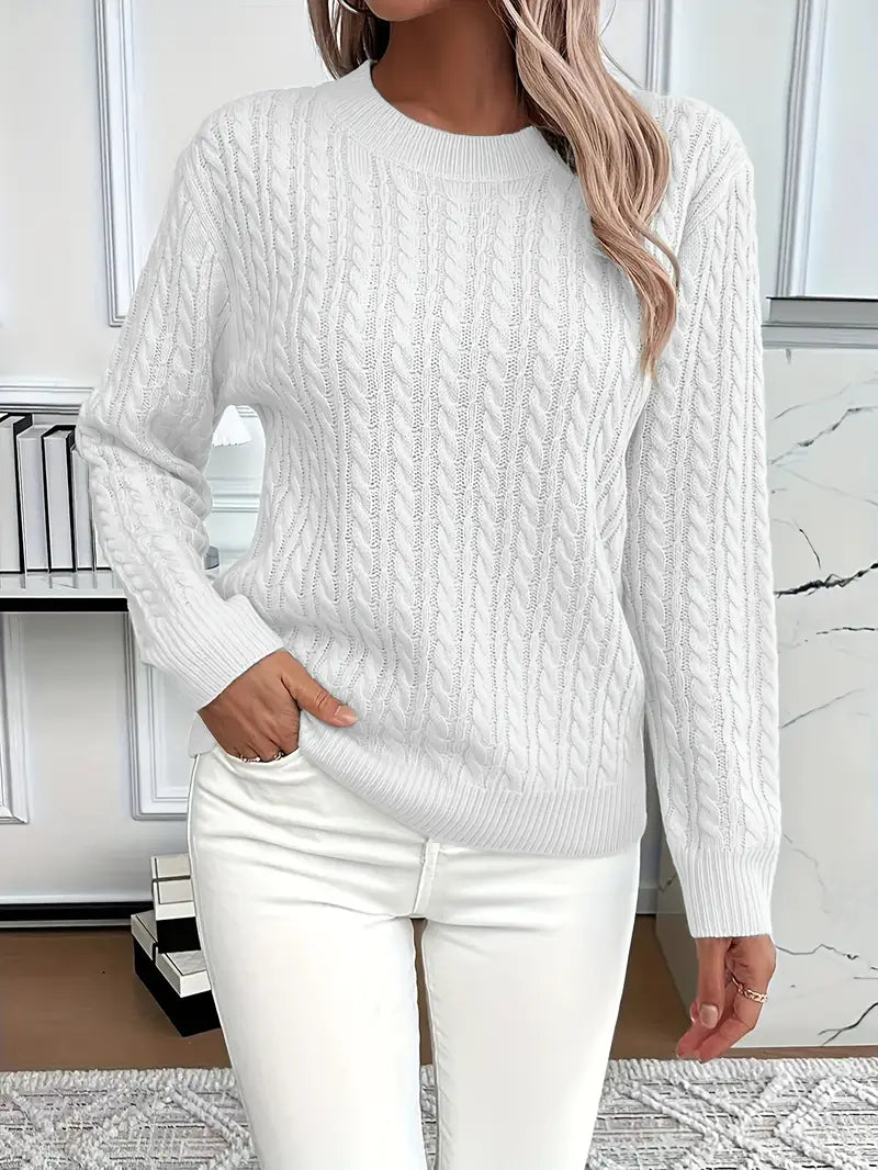 White - Women's light pink cable knit sweater with long sleeves and a crew neckline, worn with white pants.