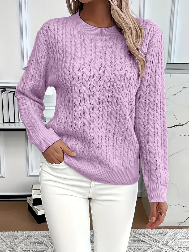 Purple - Women's light pink cable knit sweater with long sleeves and a crew neckline, worn with white pants.