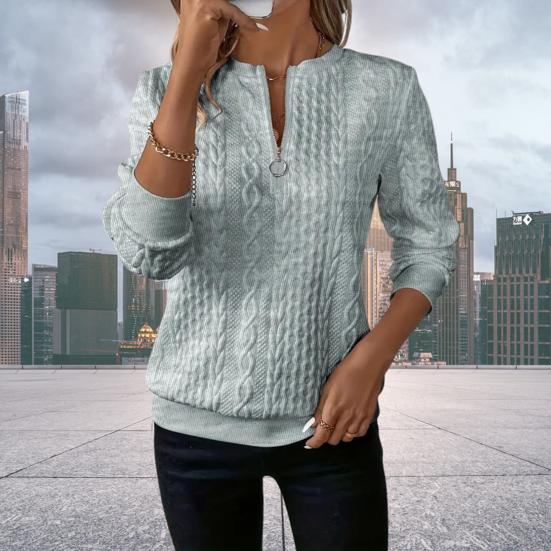 Grey - Women's white long-sleeve pullover sweater featuring an all-over cable knit texture, a half-zip front with a silver ring pull, and ribbed cuffs and hem.