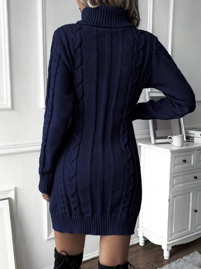 Blue - Woman wearing a heavyweight cable knit long sleeve mini dress with a high roll neck and ribbed hem.