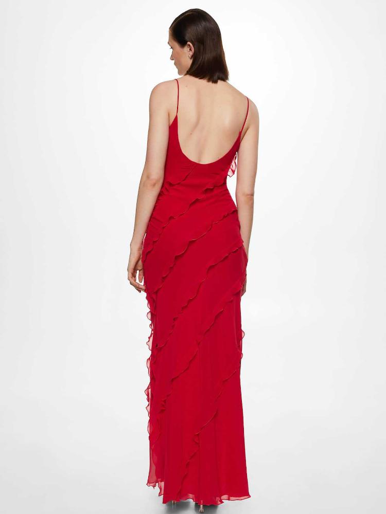 Red - A woman wearing a vibrant red chiffon maxi dress with cascading diagonal ruffles, a V-neckline, and thin spaghetti straps, posing against a rustic dark wooden door.