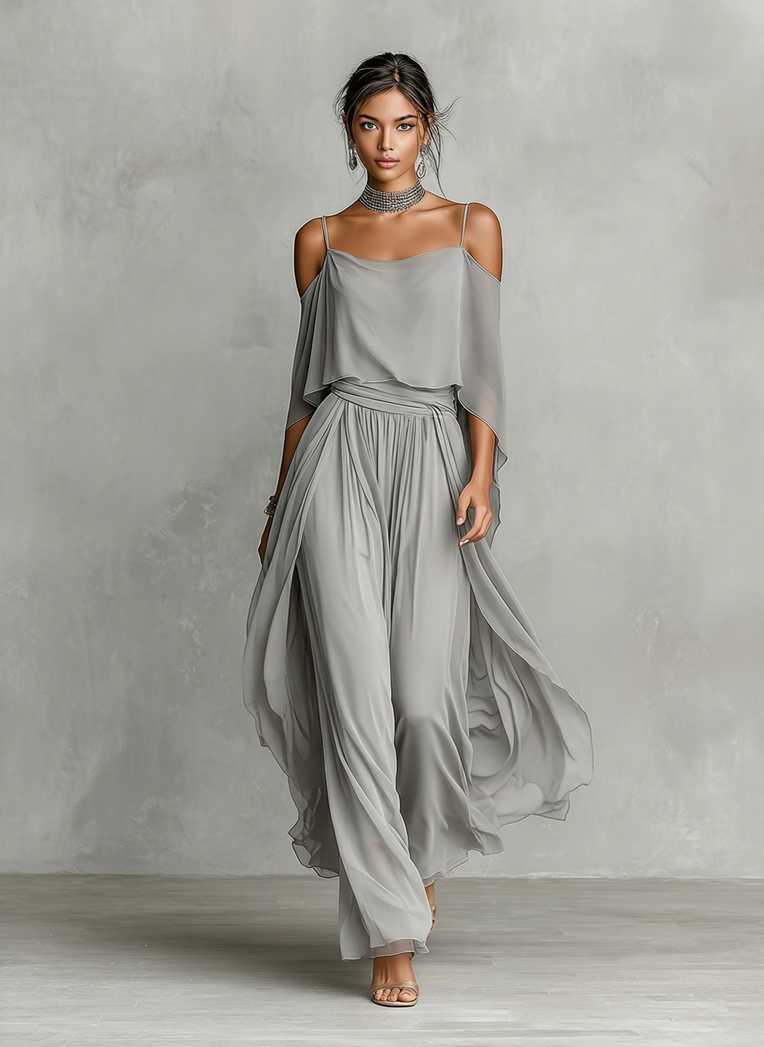 Grey - A model wears a floor-length grey chiffon maxi dress featuring delicate spaghetti straps, a draped cold-shoulder overlay, a ruched waist, and a layered, flowing skirt.