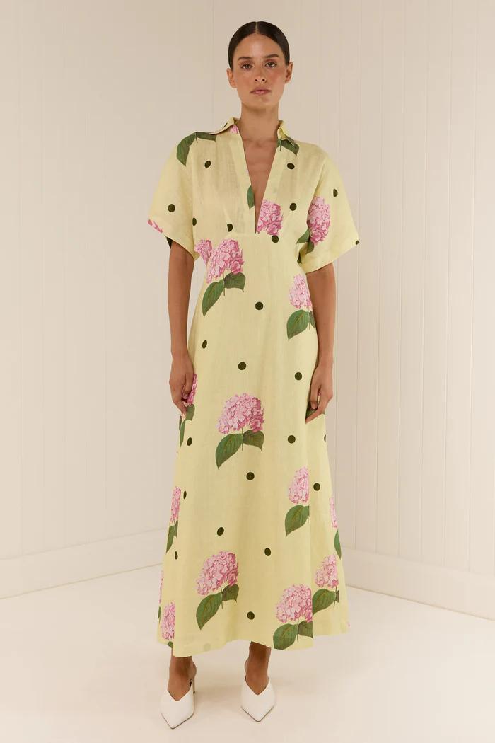 Yellow - Women's pale yellow maxi dress featuring a deep V-neck collar, short sleeves, and a vibrant pink floral and dark polka dot print.