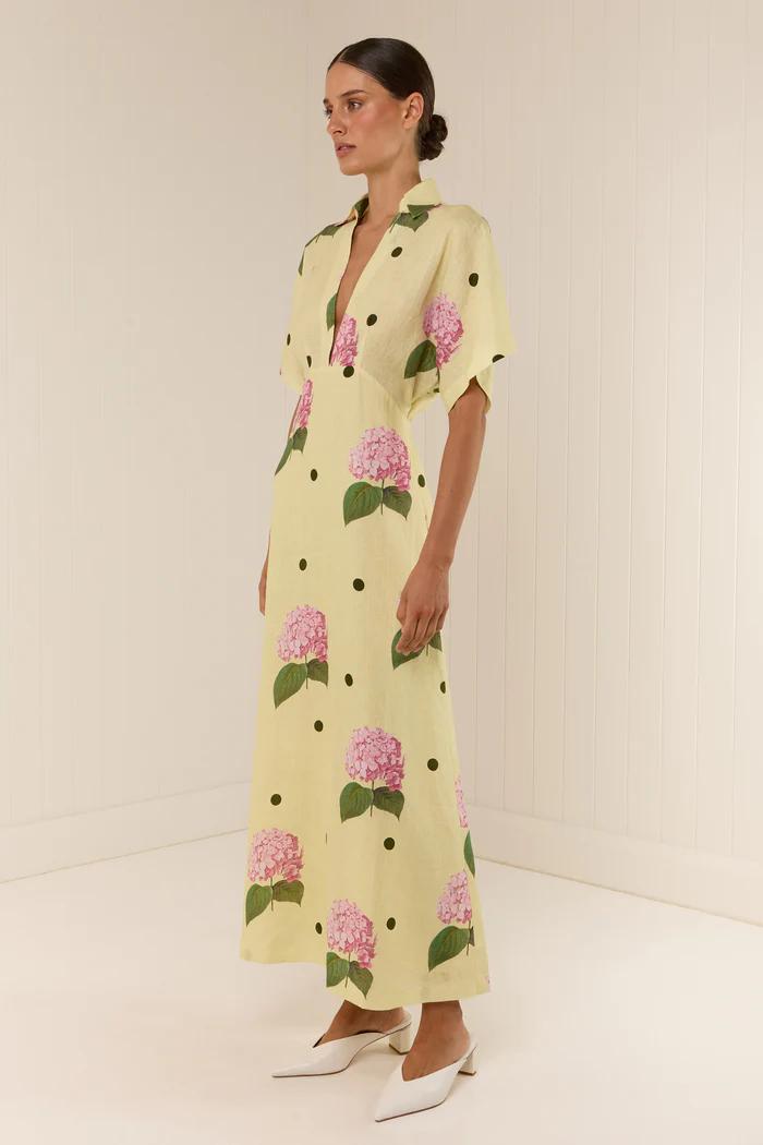 Yellow - Women's pale yellow maxi dress featuring a deep V-neck collar, short sleeves, and a vibrant pink floral and dark polka dot print.