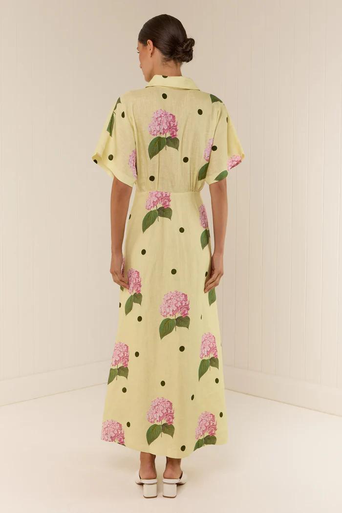 Yellow - Women's pale yellow maxi dress featuring a deep V-neck collar, short sleeves, and a vibrant pink floral and dark polka dot print.