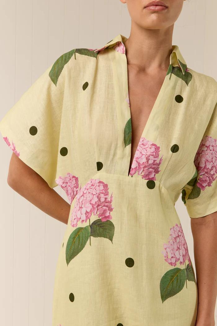 Yellow - Women's pale yellow maxi dress featuring a deep V-neck collar, short sleeves, and a vibrant pink floral and dark polka dot print.