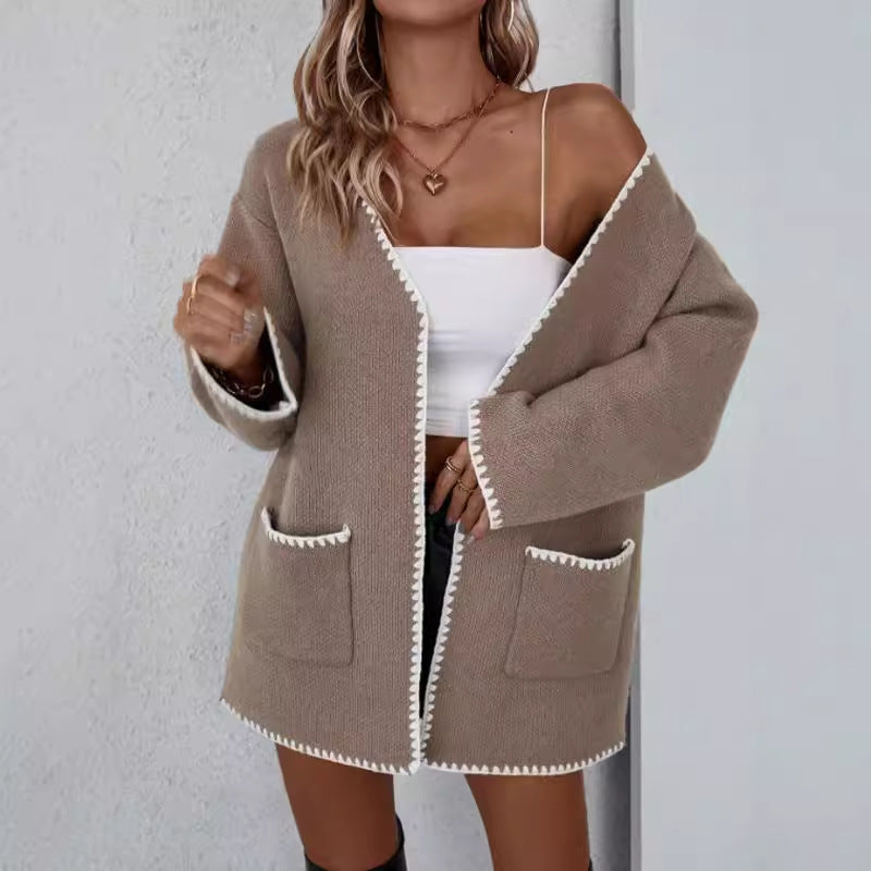 Camel - Women's mid-length, open-front knit cardigan featuring an oversized fit, drop shoulders, front patch pockets, and decorative contrast stitching along the edges.