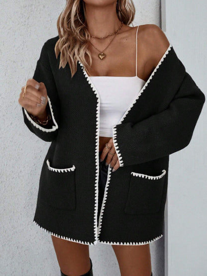 Black - Women's mid-length, open-front knit cardigan featuring an oversized fit, drop shoulders, front patch pockets, and decorative contrast stitching along the edges.