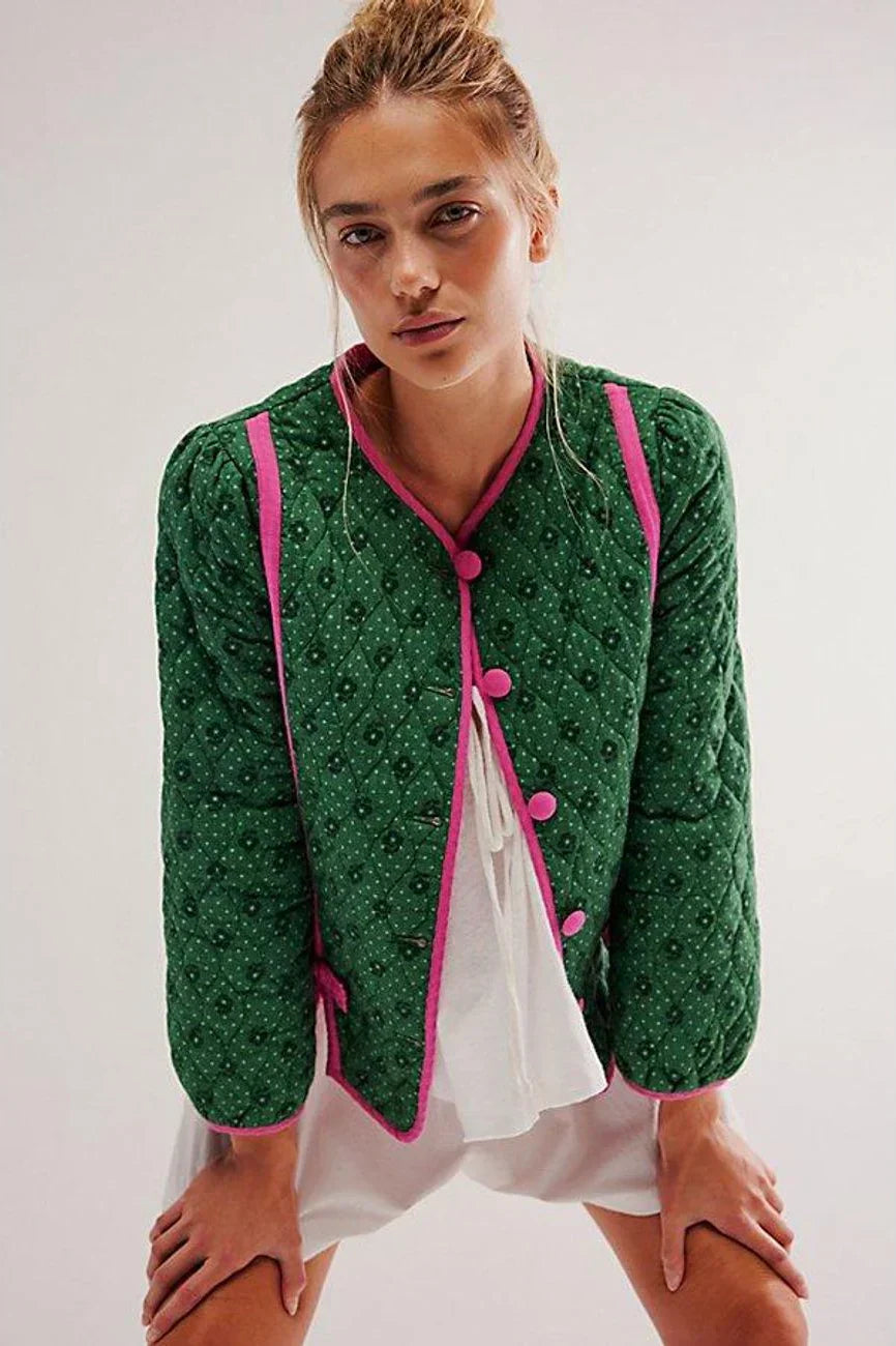 Green - Women's green diamond-quilted cropped jacket featuring a tiny floral print, bright pink contrast trim, and fabric-covered button closures, styled open over a white top.