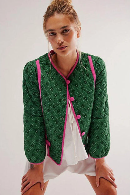 Green - Women's green diamond-quilted cropped jacket featuring a tiny floral print, bright pink contrast trim, and fabric-covered button closures, styled open over a white top.
