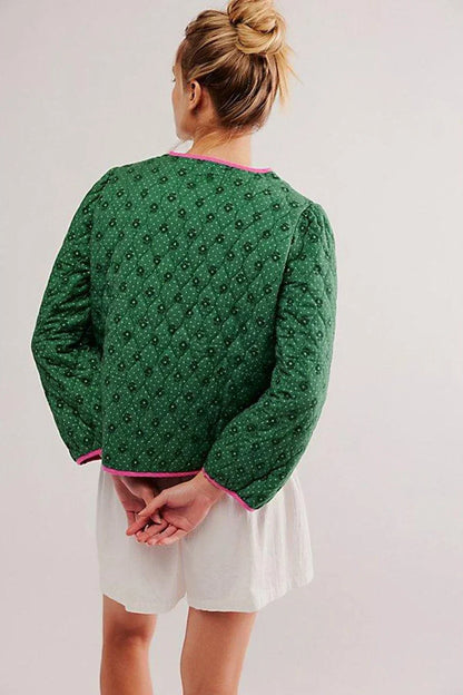Green - Women's green diamond-quilted cropped jacket featuring a tiny floral print, bright pink contrast trim, and fabric-covered button closures, styled open over a white top.