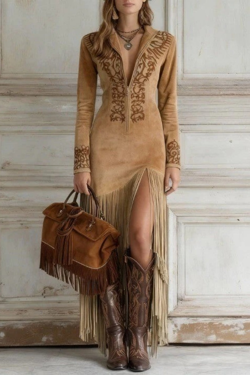 Blue - Woman wearing a long-sleeve maxi dress with intricate chest embroidery, an adjustable zip-front neckline, and a dramatic floor-length fringed skirt with a high leg slit, styled with western boots.