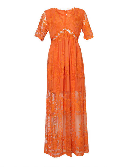 Women's resort maxi dress featuring a deep V-neckline, short flutter sleeves, and intricate floral lace embroidery on a sheer overlay with a partial lining.
