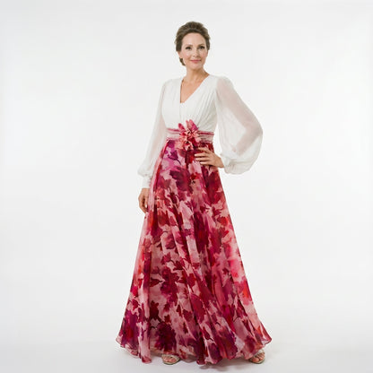 White&Wine Red - A woman posing in a floor-length navy and white floral chiffon maxi dress featuring a deep V-neckline, sheer balloon sleeves, and a 3D floral applique at the waist.