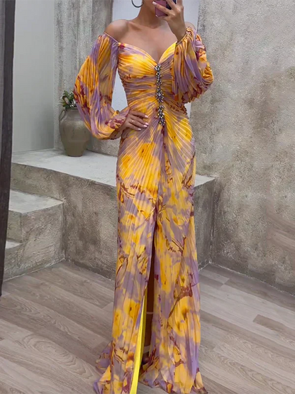 Multicoloured - Woman wearing a long sleeve, pleated floral maxi dress with a jewelled front trim and high slit