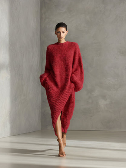 Red - A woman wearing an oversized, cream-coloured fluffy knit midi dress with a high neckline, long voluminous sleeves, and an asymmetric draped wrap hemline.
