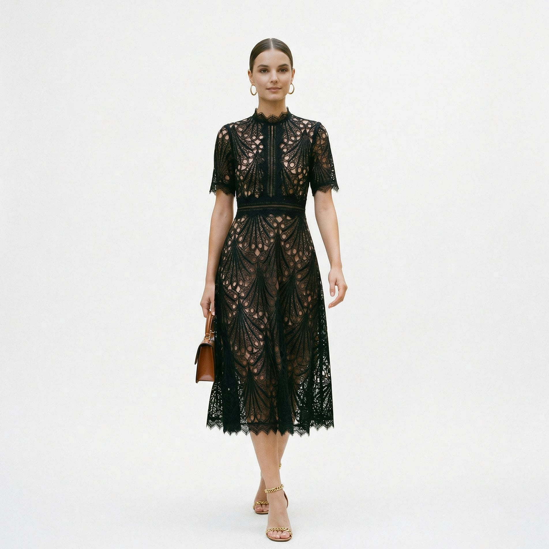 Black - A woman wearing a black geometric lace midi dress with a high neck, short sleeves, and a defined waist, featuring a nude lining and scalloped hem.
