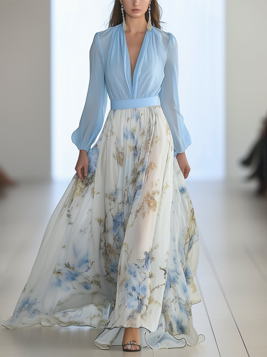 3XL - Woman modelling a long sleeve georgette maxi dress featuring a pleated bodice and a flowing layered skirt with a floral print.