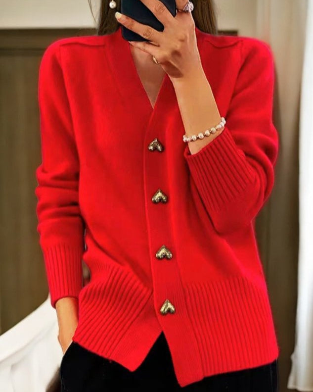 Red - Women's grey V-neck knit cardigan featuring metallic gold heart-shaped buttons, drop shoulders, and wide ribbed cuffs and hem.