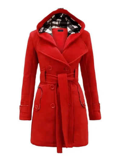 Red - A woman wearing a cream-coloured, mid-length double-breasted trench coat with a hood, a tied waist belt, and black pants.