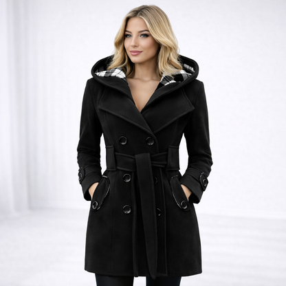 Black - A woman wearing a cream-coloured, mid-length double-breasted trench coat with a hood, a tied waist belt, and black pants.