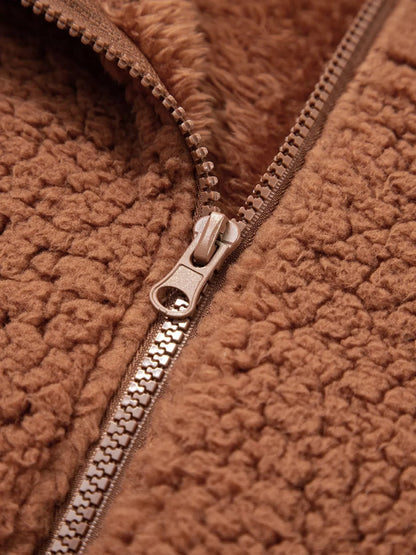 Brown - Women's brown hooded teddy fleece jacket with front zipper and patch pockets, worn over a white t-shirt and jeans.
