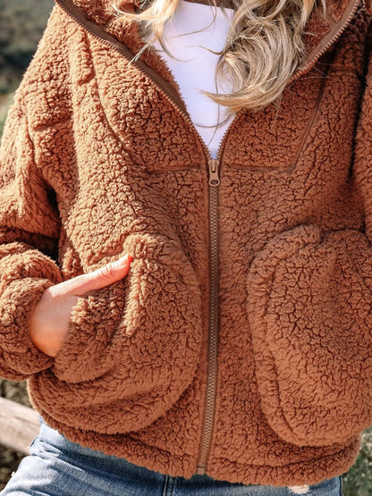 Brown - Women's brown hooded teddy fleece jacket with front zipper and patch pockets, worn over a white t-shirt and jeans.