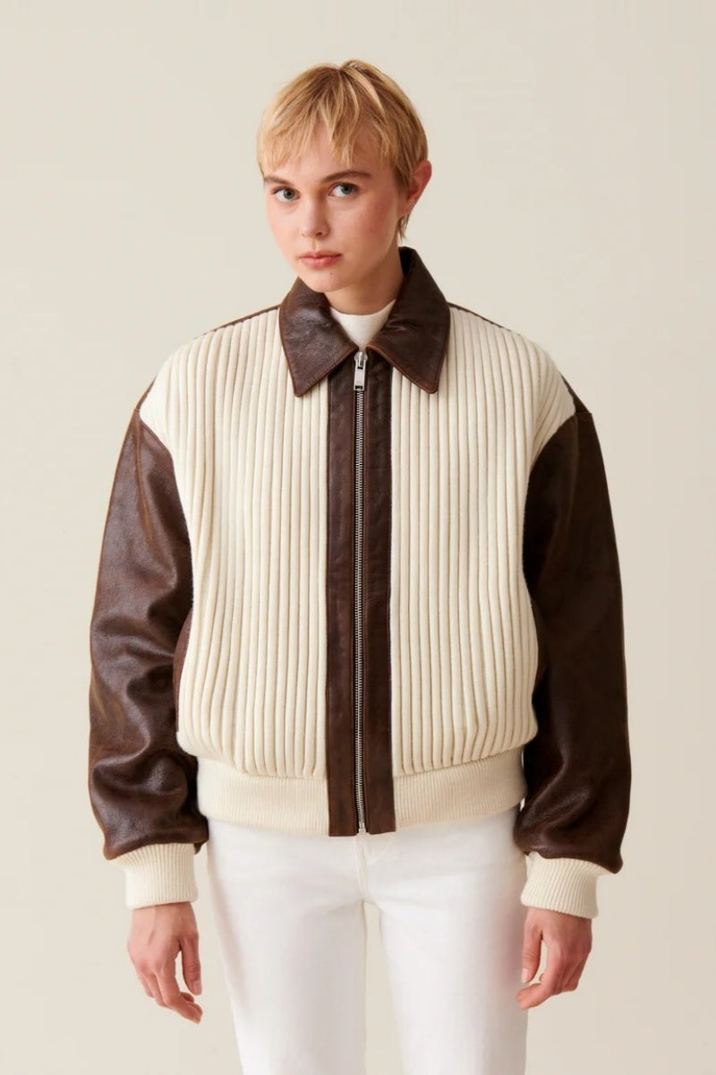White - Women's oversized bomber jacket featuring a cream ribbed knit body with contrasting brown faux leather sleeves, collar, and zip placket.