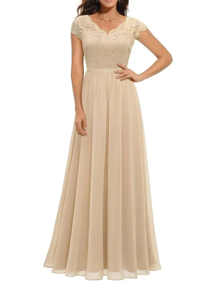 Champagne Short Sleeve - Woman wearing a long A-line maxi dress featuring a lace bodice with 3/4 sleeves and a flowing pleated georgette skirt