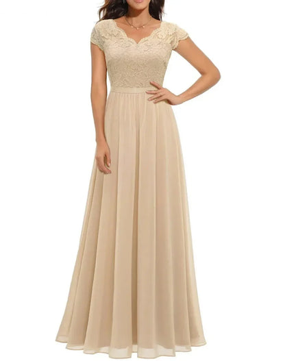 Champagne Short Sleeve - Woman wearing a long A-line maxi dress featuring a lace bodice with 3/4 sleeves and a flowing pleated georgette skirt